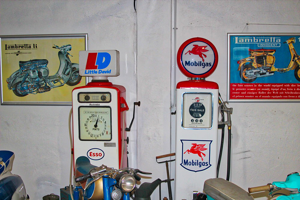 Vintage petrol pumps and motorcycles